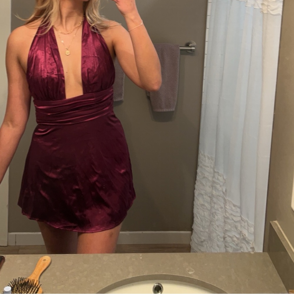 Dark purple satin dress.